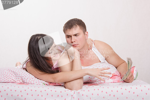 Image of Wife suck up to her husband