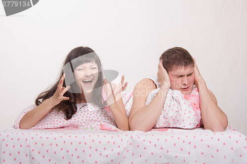 Image of wife hysterical husband covered his ears