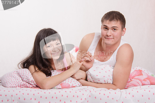 Image of Lovers put up in bed after an argument