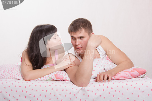 Image of Wife suck up to her husband