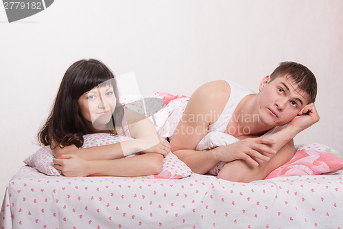 Image of Young couple in bed dreaming