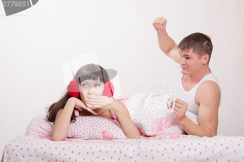 Image of Man in quarrel ready to hit a girl