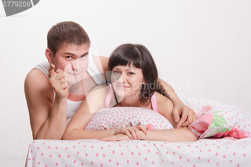 Image of Happy man and woman in bed
