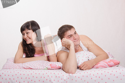 Image of Wife mocks tired husband