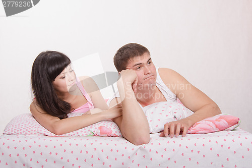 Image of Husband was offended by his wife, resting in bed