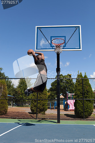 Image of Basketball Player Dunking