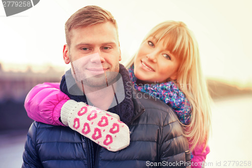 Image of Woman in lovely mittens and her boyfriend