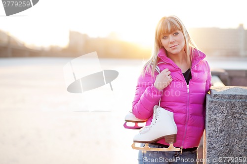 Image of Figure skater woman in city riverfront