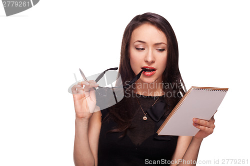 Image of Sexy woman in glasses with notepad