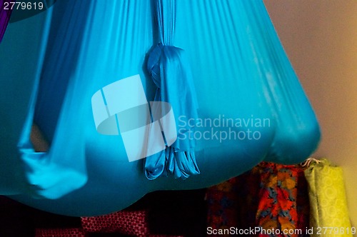 Image of person suspended in aerial yoga hammock