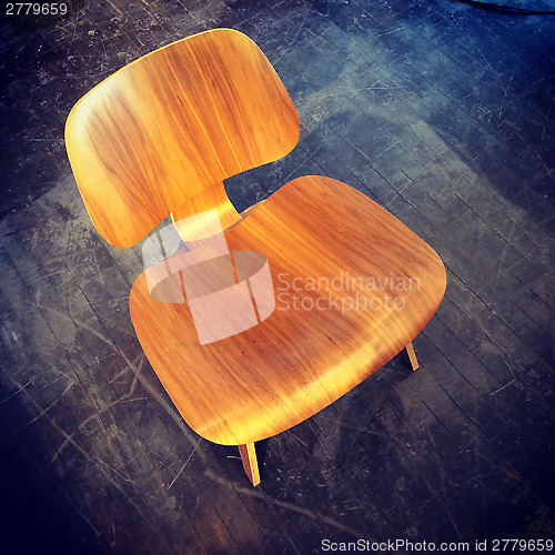 Image of Retro style chair on dark floor