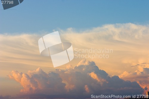 Image of red, yellow and orange clouds on blue sky