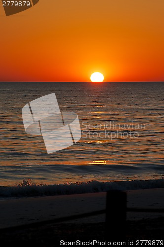 Image of orange sunset over beach