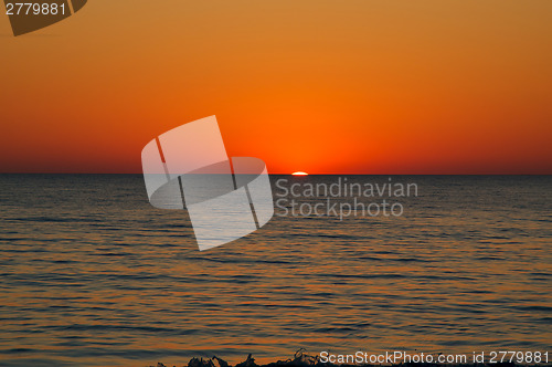 Image of orange sunset over horizon