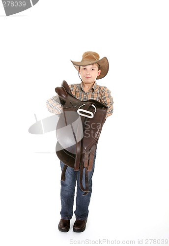 Image of Boy carrying a saddle