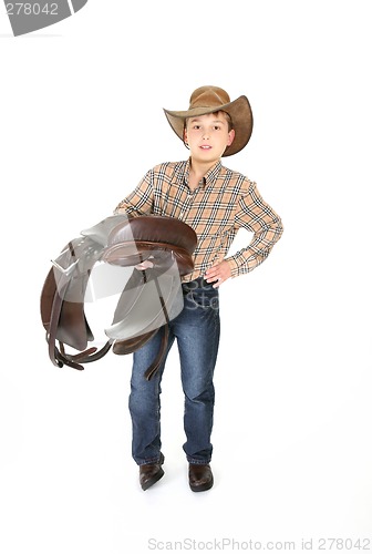 Image of Young rider holding a saddle