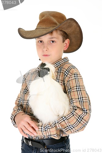 Image of Country boy holding a chicken