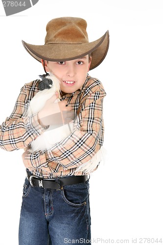 Image of Boy cuddling a pet chicken