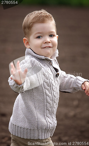 Image of happy 2 years old baby boy in motion