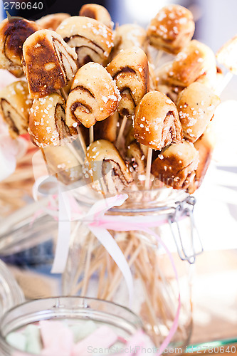 Image of Small cinnamon buns on sticks