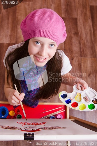 Image of Twelve year old girl studying in the school of art