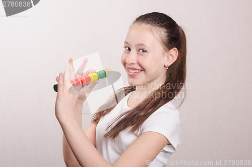 Image of Teenage girl playing the flute