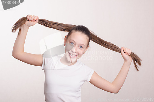 Image of Portrait girl of twelve in a positive mood