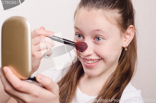 Image of Girl twelve years powders spout