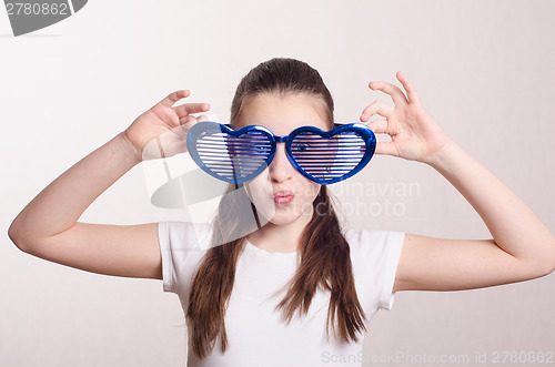 Image of Smiling girl in big funny glasses