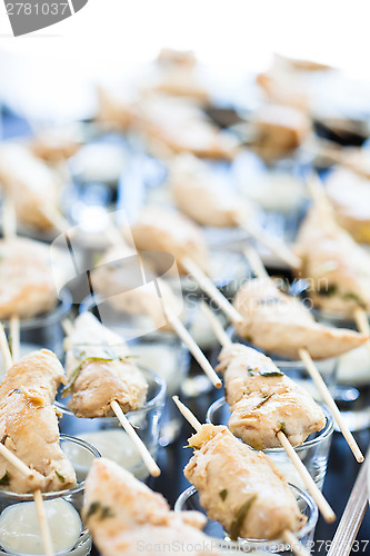 Image of Chicken pieces on skewers