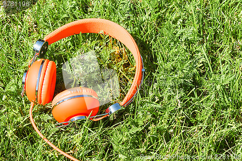 Image of Vibrant orange wired headphones