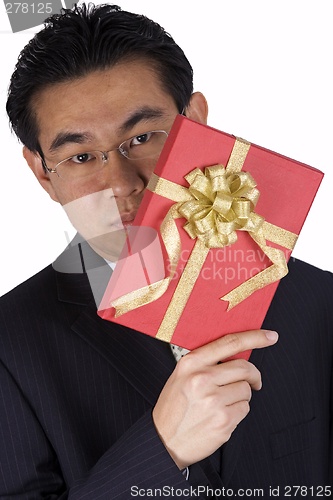 Image of Chinese Businessman holding Present