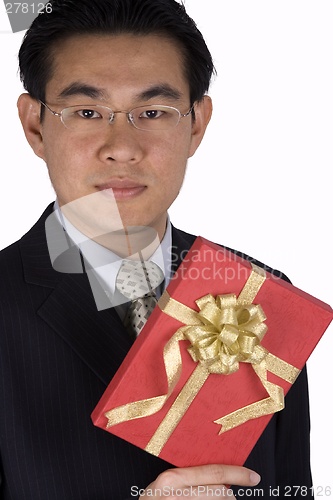 Image of Chinese Businessman holding Present