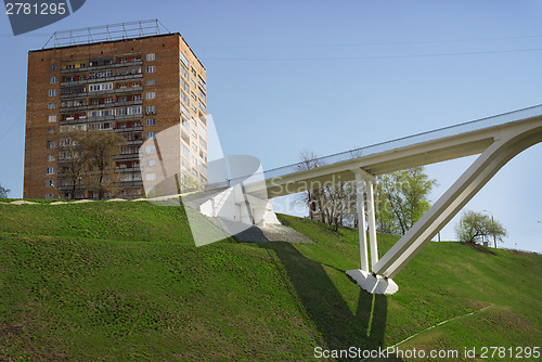 Image of Pedestrian bridge of concrete across the ravine