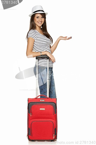 Image of Woman tourist with suitcase