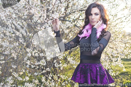 Image of Fashion spring girl with pink feather earrings