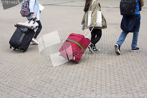 Image of Tourists with a suitcase
