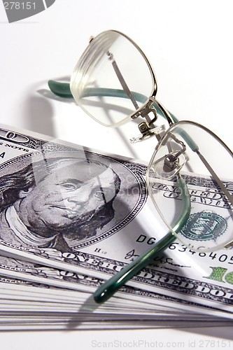 Image of Eyeglasses and Money