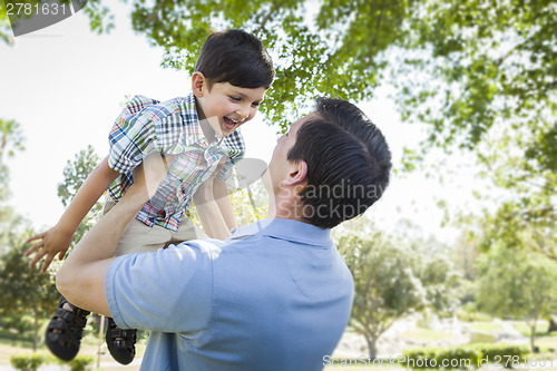 Image of Father and Son Playing Together in the Park