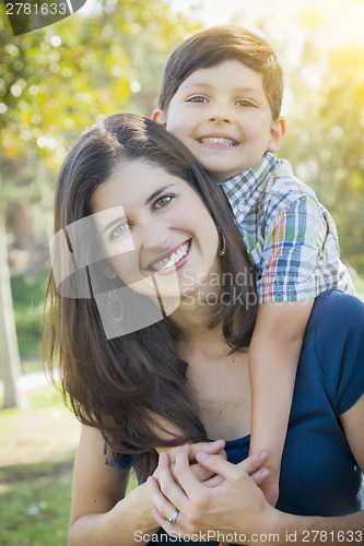 Image of Attractive Mixed Race Mother and Son Hug in Park