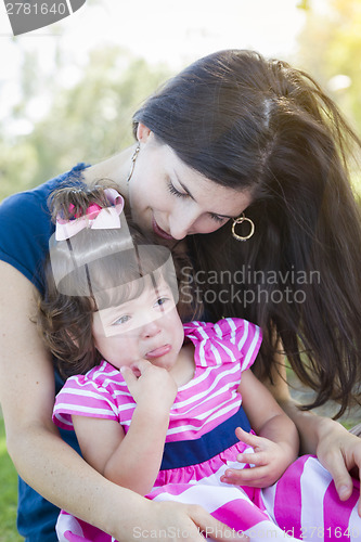 Image of Loving Mother Consoles Crying Baby Daughter