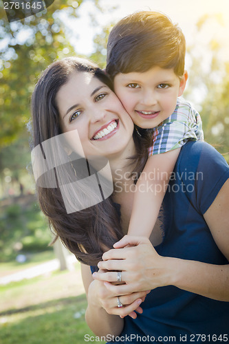 Image of Attractive Mixed Race Mother and Son Hug in Park