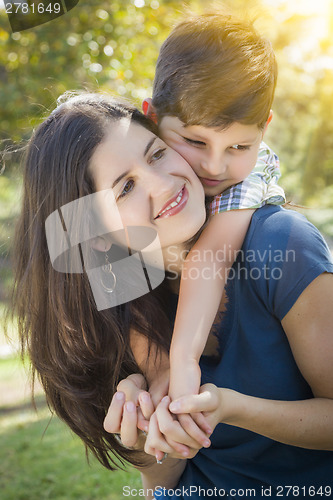 Image of Attractive Mixed Race Mother and Son Hug in Park