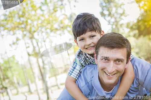 Image of Father and Son Playing Together in the Park