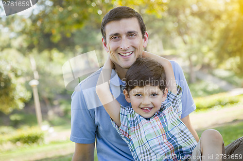 Image of Handsome Mixed Race Father and Son Park Portrait