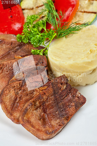Image of tongue with grilled vegetable