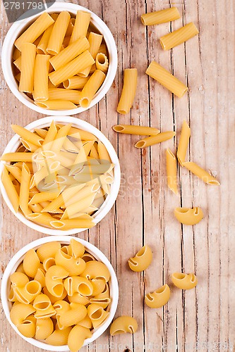Image of uncooked pasta in three bowls