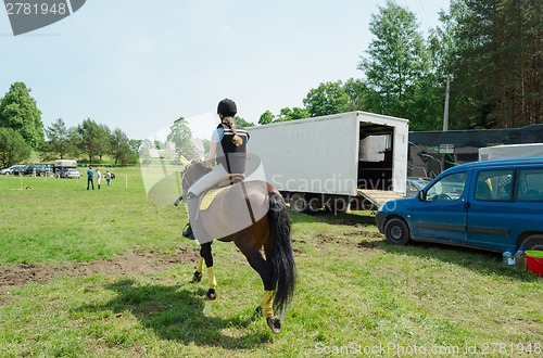 Image of girl ride dwarf horse 