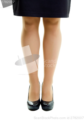 Image of Female legs in skirt and high heels. isolated