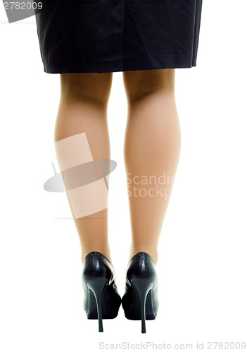 Image of Female legs in skirt and high heels. isolated